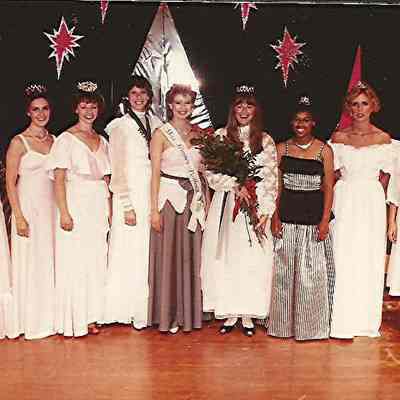 A color photograph of of a group of Queen's.