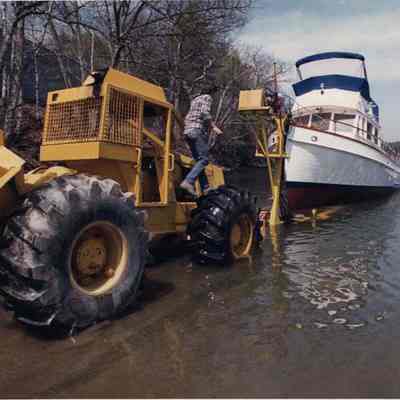 A photo view of putting a boat into the water. 5/2/1990.