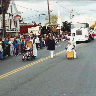 some women pushing baby carriages in the 250th Anniversary Parade