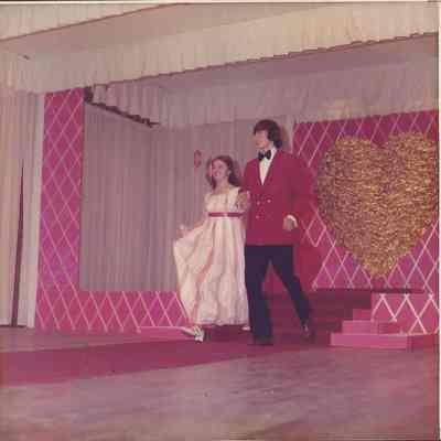 Contestant #3 Linda Hinckley escorted to the microphone by Jim Lewis.