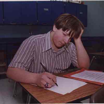 A photo view of a student taking a test. 2/22/1988.