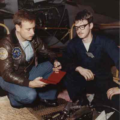 A photo view of two mechanics. 11/15/1989.