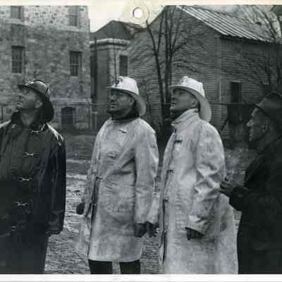Firemen Looking at the St. John's Catholic School Fire