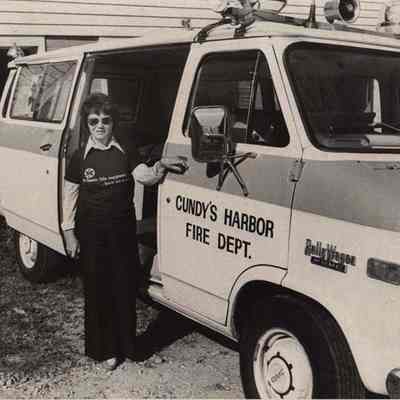 A photo view of a girl in front of a van. 10/6/1988