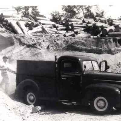 A photo view of a man loading his truck.