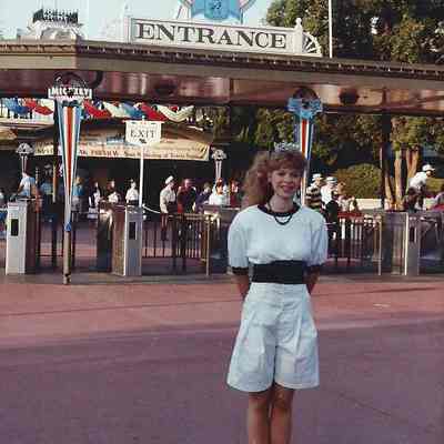 Lisa Kelly at the entrance to Epcot Center.