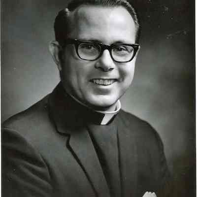 A B/W photograph of a catholic priest.