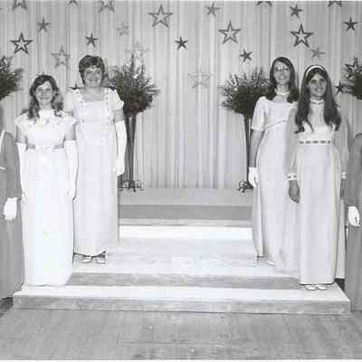 A group picture of the contestants in evening gowns