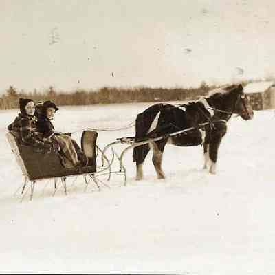 Three People in a Horse Drawn Sleigh