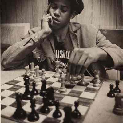 A photo view of a young man playing chess