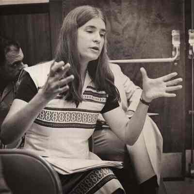 A photo view of a woman sitting.9/3/1980