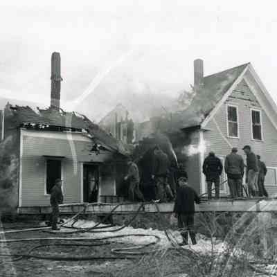 A photo of a house destroyed by fire. 3/23/1955