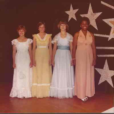 The first four contestants posing in their gowns