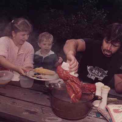 A photo view of a family having a lobster cookout. 8/8/1988.