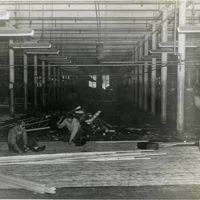 Workmen Putting Down a New Floor in the Weave Room