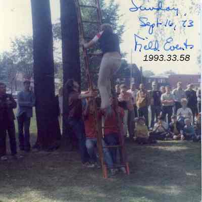 A photo of a man climbing a ladder. 9/16/1973