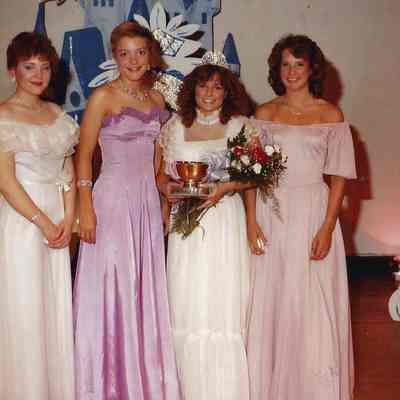 A color photograph of the 1983 Miss Brunswick and her court .