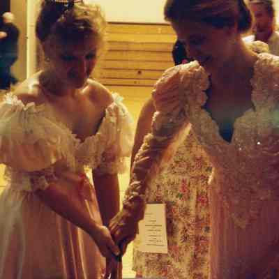 Lisa Kelly and Michele Byras cutting cake.