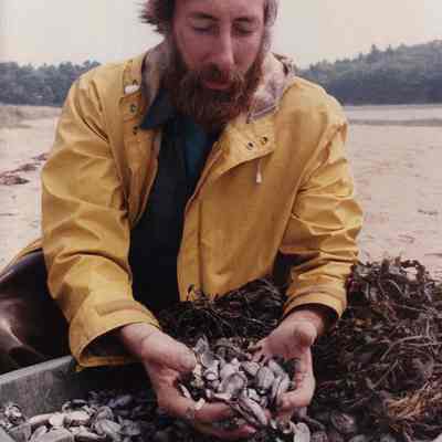 A photo view of a fisherman with a lot of clams. 8/7/1989.