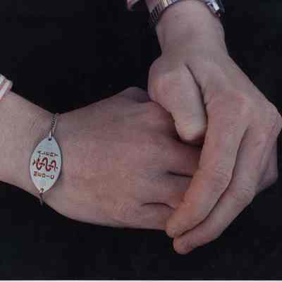 A photo view of a medic alert bracelet.12/18/1990.