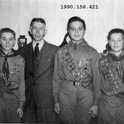 Archie Holmes, Scout Leader, and three Scouts