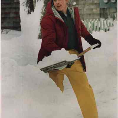 A photo view of Lee Caesar shoveling his driveway. 1/5/1987.
