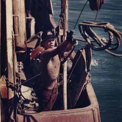 A photo view of a young man at work at Cundy's Harbor. 9/26/1988.