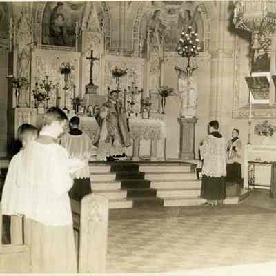 Father Dauphin at the Altar of St. John's Church