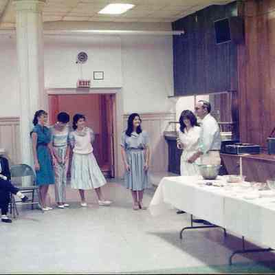 A color photograph of Gene Gagne introducing the contestants.