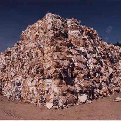 A photo view of a pile of baled up paper. 10/04/1990.