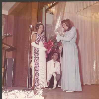 Agnes Racine enjoying her gift while Althea and Gene are looking on