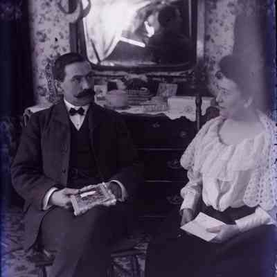 Alfred LeTarte sitting with a lady.