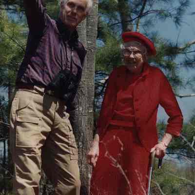 A photo view of two people in the woods. 5/4/1990.