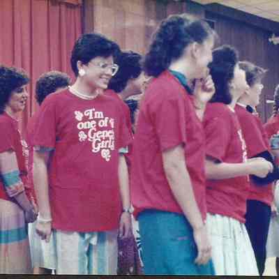 A color photograph of the girls laughing at the explanation