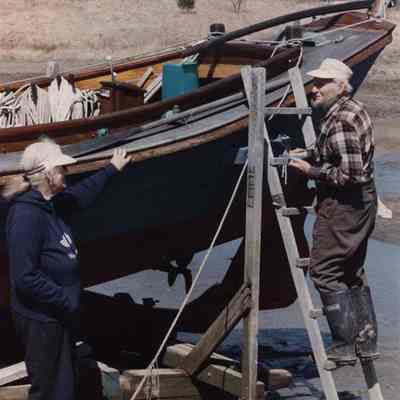 A photo view of 2 people talking. 5/8/1989.