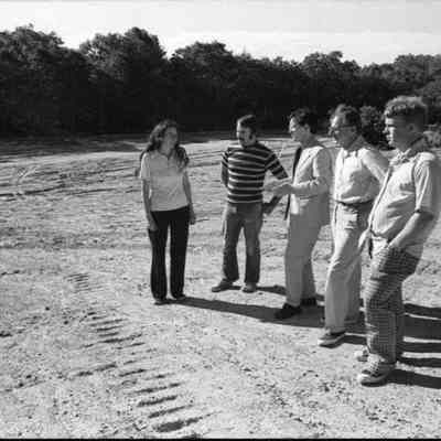 A photo view of people looking over Woolwich Dump. 7/6/1977.