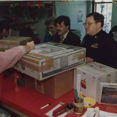 A photo view of people shipping packages. 12/10/1987.