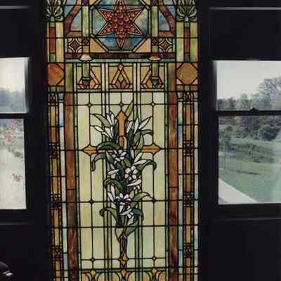 A photo view of a stained glass window. 10/13/1989.