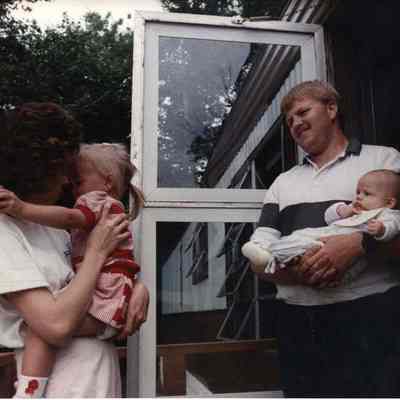 A photo view of a couple with 2 children. 8/21/1989.