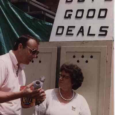 A photo view of 2 people talking. 6/29/1989.