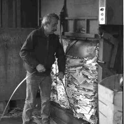 A photo view of a workman at Harpswell's recycling center. 1/13/1989.