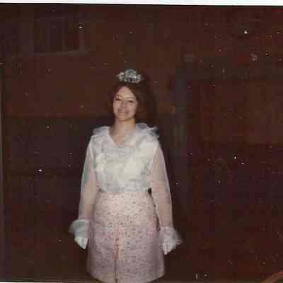 A color Polaroid photograph of a girl wearing a tiara.