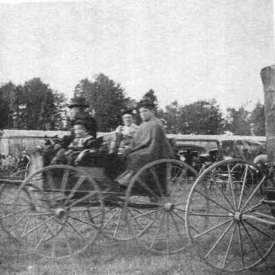 A photo of people at the Topsham Fair.