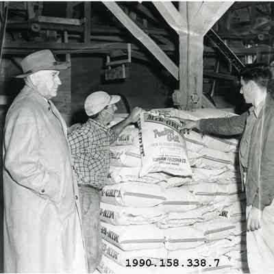 A photo of three men in Topsham Feldspar Co. 1955.