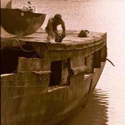 A photo view of a boat being dismantled. 11/1/1986