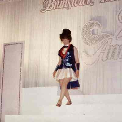 A color photograph of Glena Bassinet modeling the costume from the 1971 pageant.