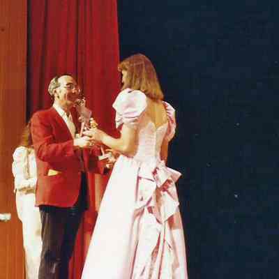 Gene Gagne presenting a participant trophy to Cindy Pomerleau