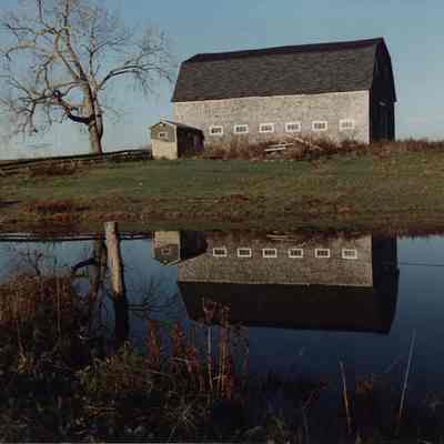A photo view of a barn's reflection. 10/25/1989.