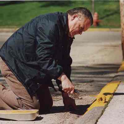 Workman Painting the Sidewalk