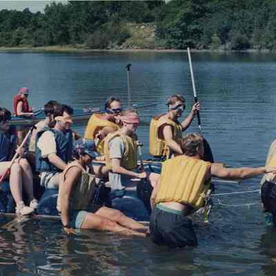 A photo view of some kids paddling a raft. 9/13/1991.